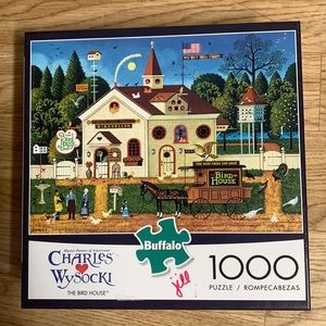 Three 1000 piece Charles Wysocki puzzles